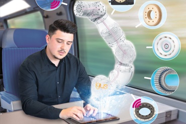 Man works with tablet on the train and animates robot arm